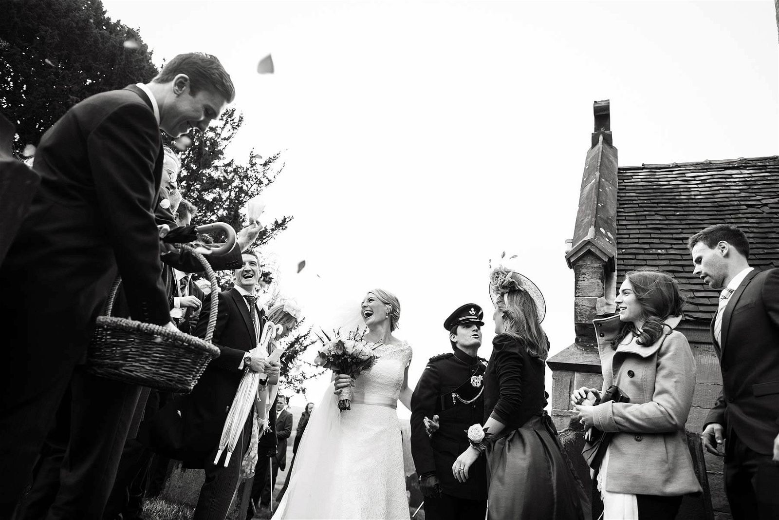 Fabulous emotions and expressions captured in this wonderful reportage photograph as the bride and groom leave the church at Sandon Hall in Stafford by Documentary Wedding Photographer Stuart James
