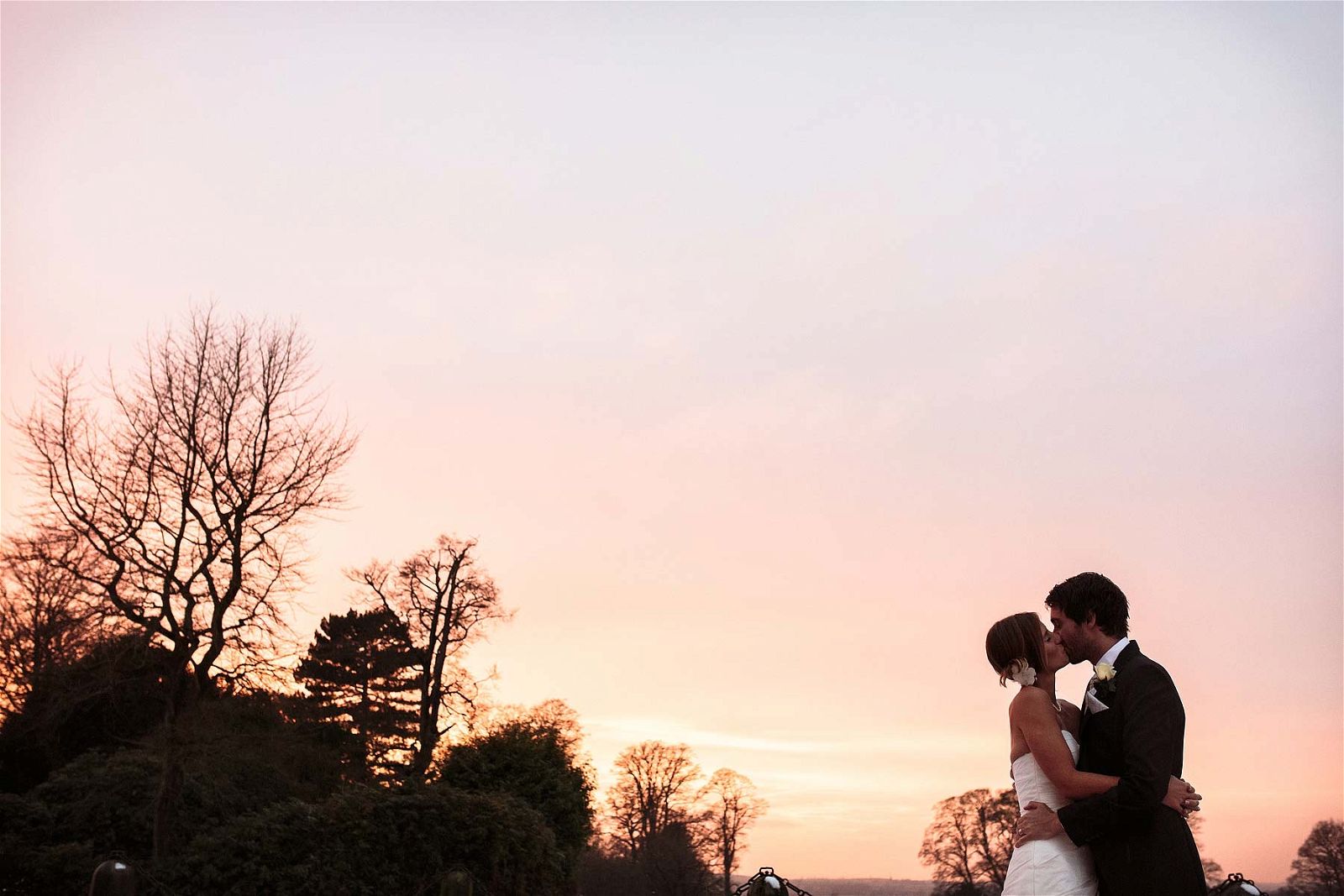 A beautiful embrace at sunset for this stunning couple at Sandon Hall in Stafford by Documentary Wedding Photographer Stuart James