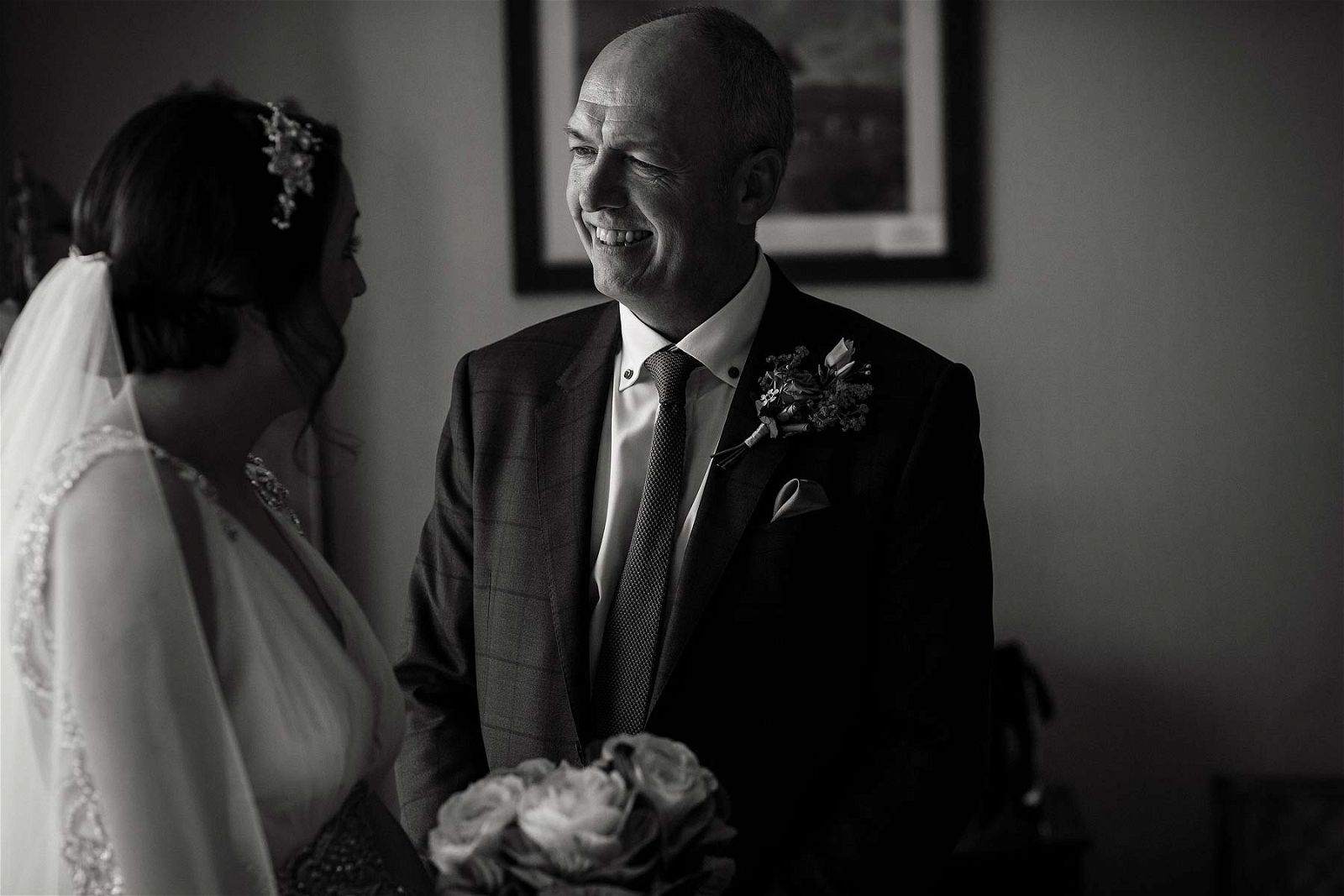 Emotions captured as Bride sees daughter for first time in wedding gown at Sandon Hall in Stafford by Stafford Documentary Wedding Photographer Stuart James