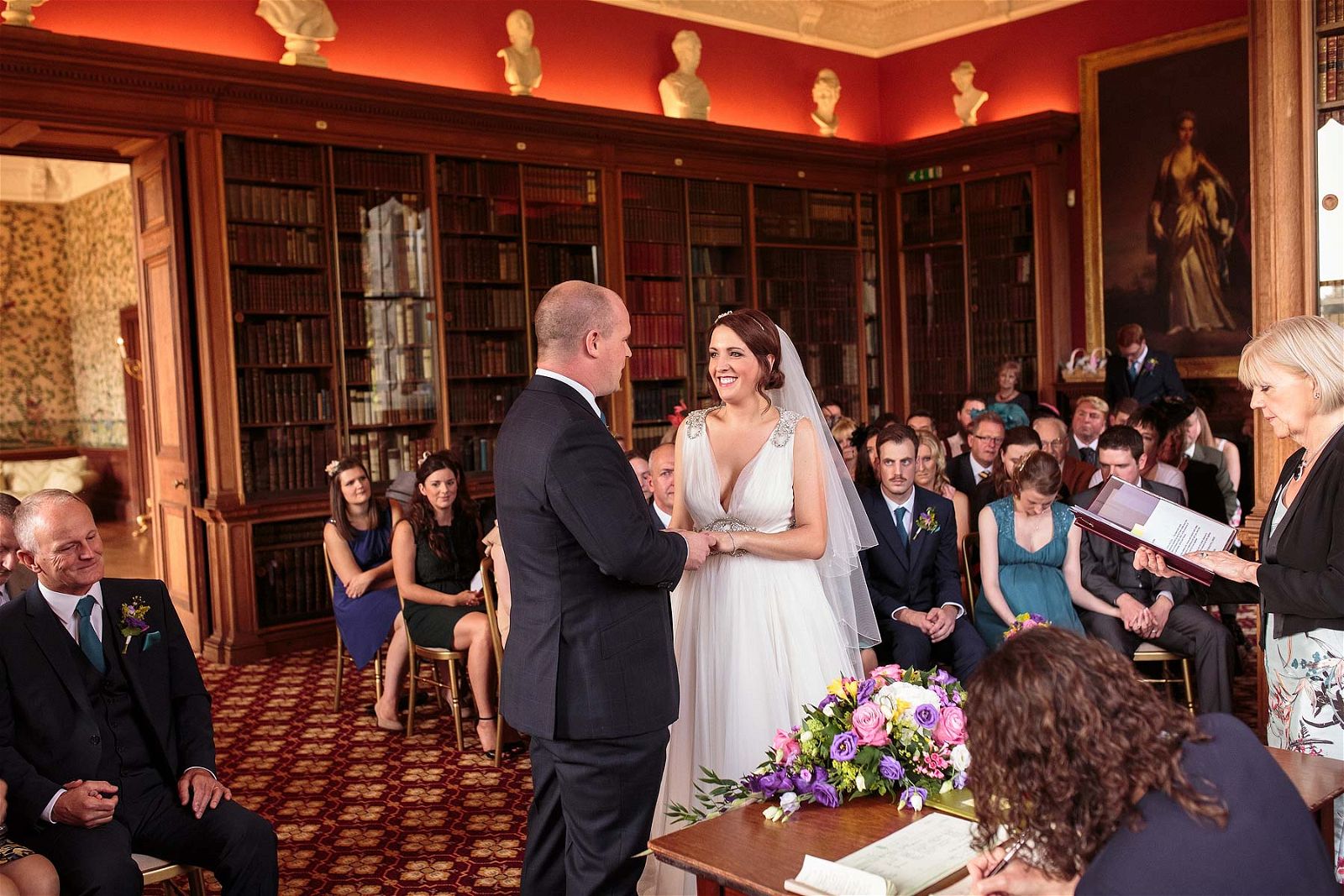 Unobtrusive photographs capturing the story of the wedding ceremony at Sandon Hall in Stafford by Stafford Reportage Wedding Photographer Stuart James
