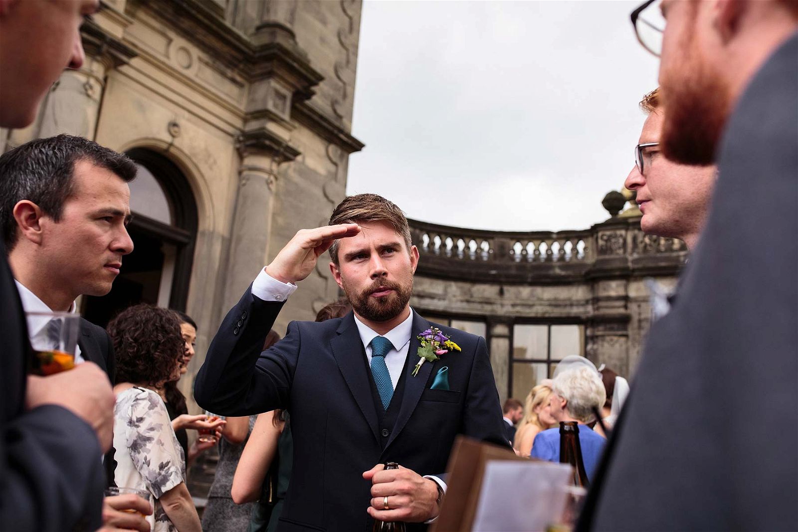 Candid photographs of the guests enjoying the drinks reception on the lawns at Sandon Hall in Stafford by Stafford Reportage Wedding Photographer Stuart James