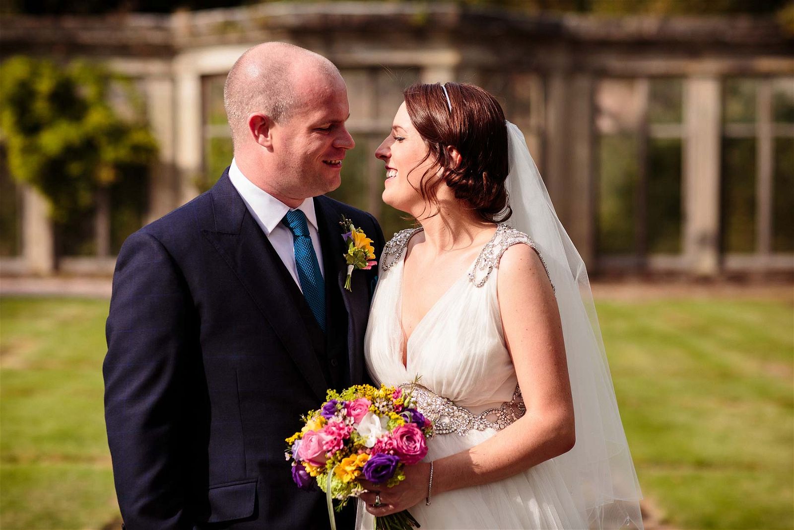 Creative relaxed couple portraits around the wonderful garden of Sandon Hall in Stafford by Stafford Reportage Wedding Photographer Stuart James