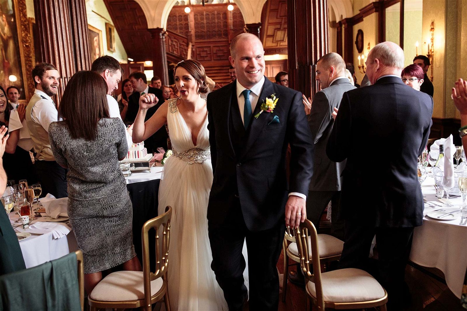 Stunning candid photos of entrance to wedding breakfast at Sandon Hall in Stafford by Stafford Documentary Wedding Photographer Stuart James
