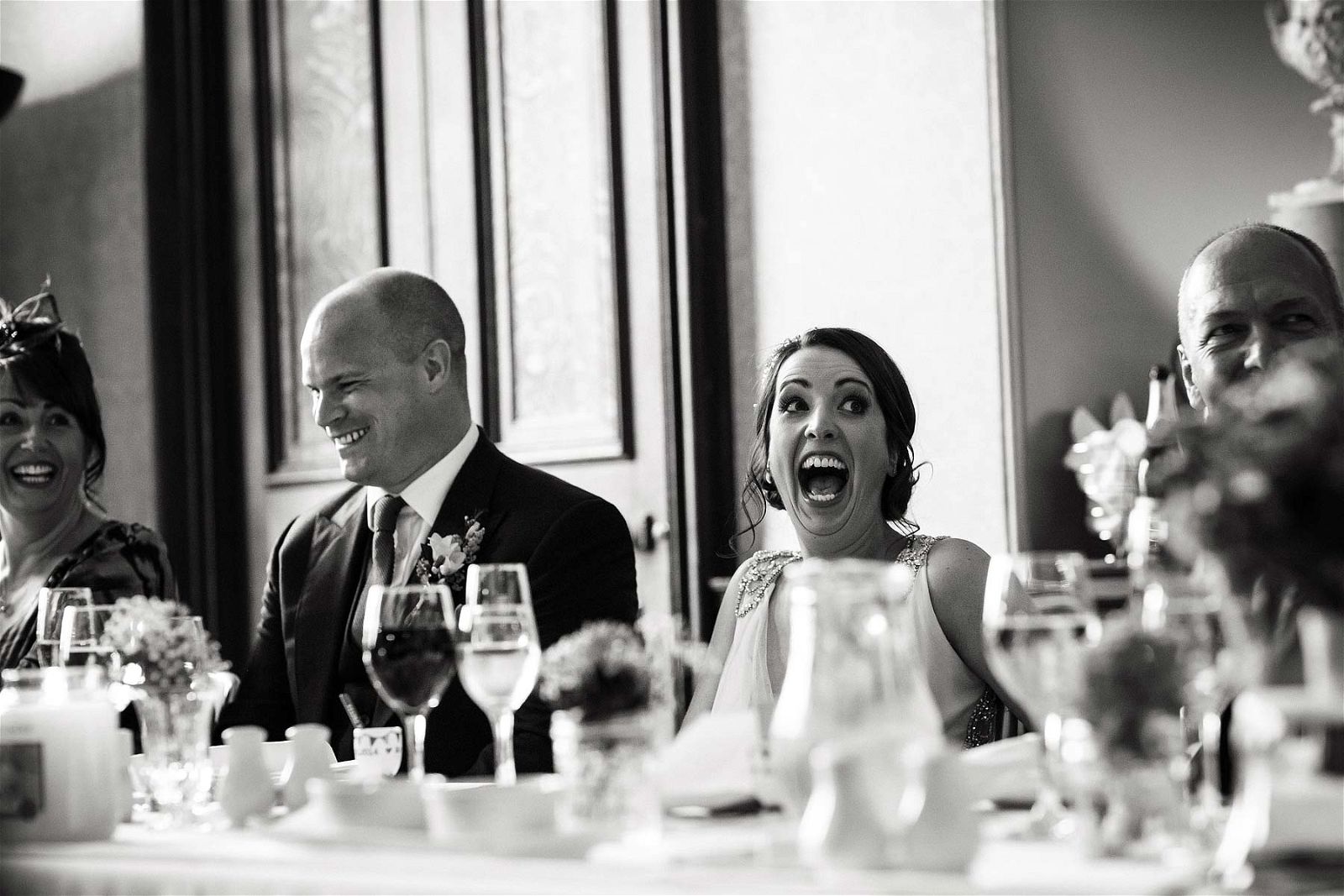 Candid photos that capture the emotion and characters during the entertaining wedding speeches at Sandon Hall in Stafford by Stafford Documentary Wedding Photographer Stuart James