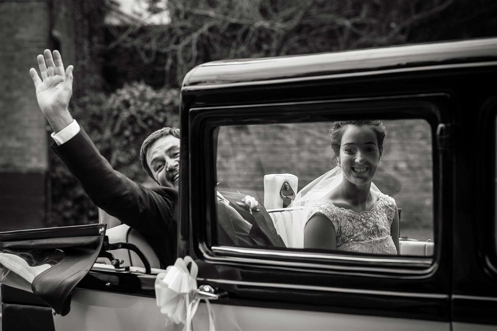 Relaxed fun arrival of the Bride and her father to St Chads Church in Pattingham by Pattingham Wedding Photographer Stuart James