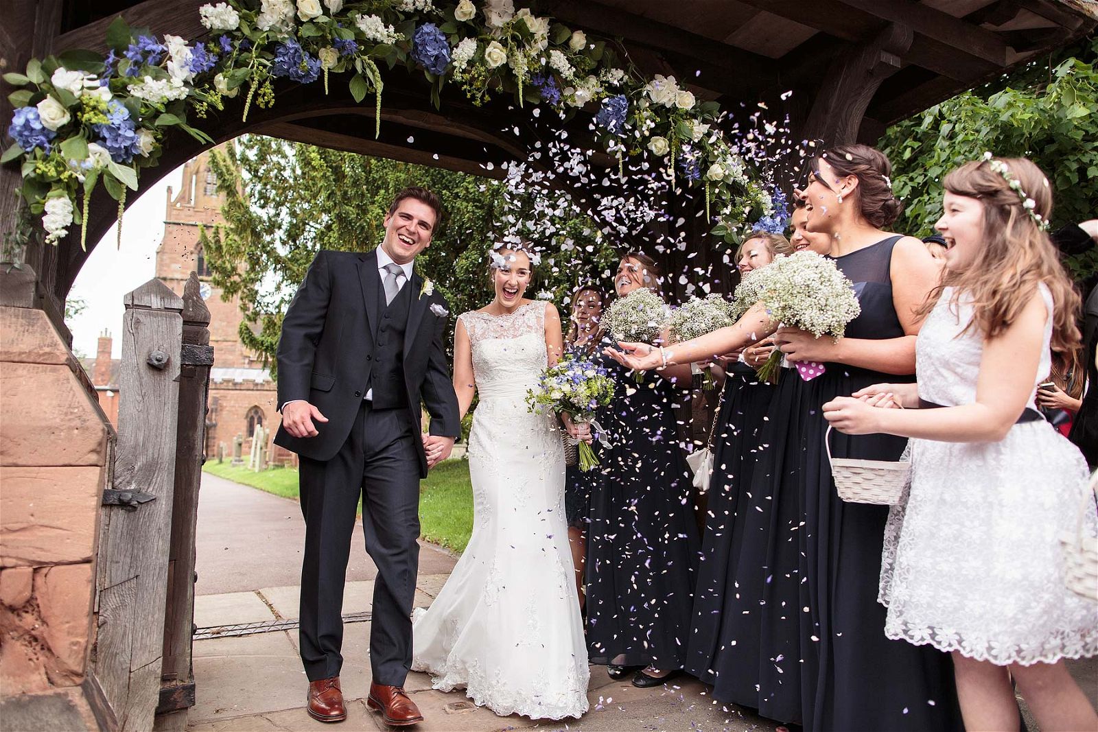 Fabulous confetti photograph as Bride and Groom leave St Chads Church in Pattingham by Pattingham Wedding Photographer Stuart James