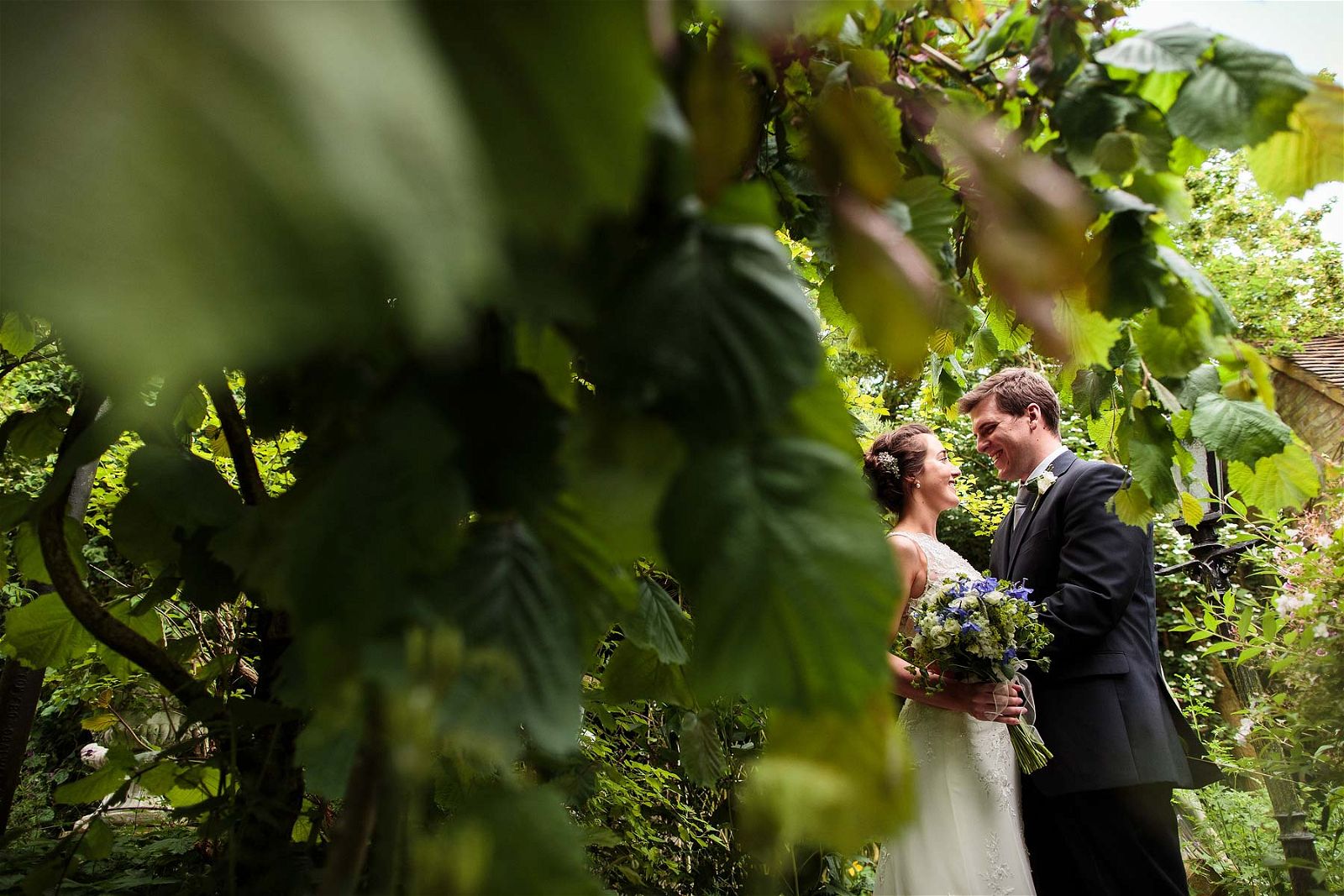 Relaxed intimate portraits of the beautiful bride and groom around the gardens at Hundred House Hotel in Norton by Shropshire Documentary Wedding Photographer Stuart James