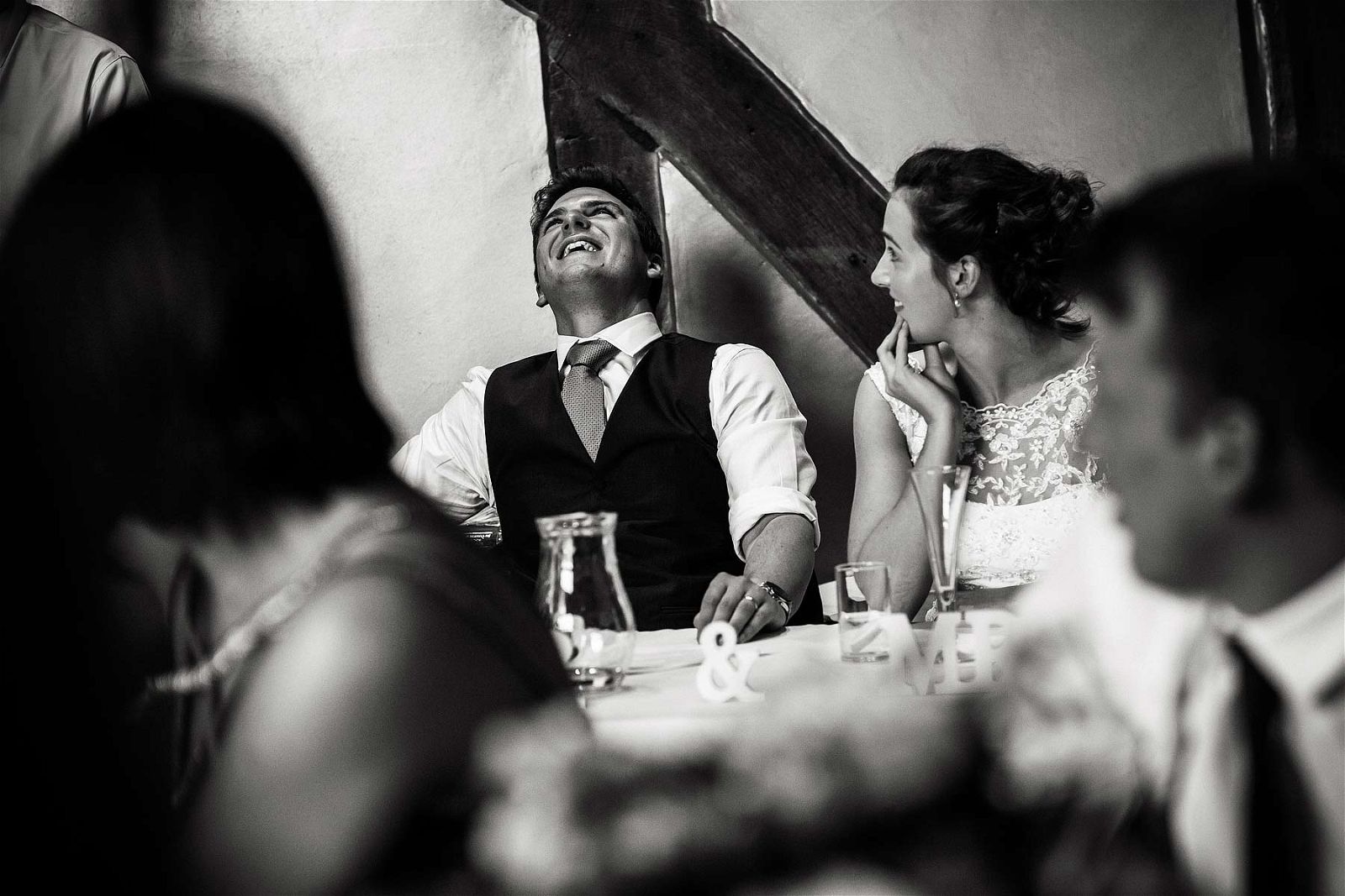Wedding photos that capture the fun, emotion and excitement of the wedding breakfast and the fabulous speeches in the barn at Hundred House Hotel in Norton by Shropshire Documentary Wedding Photographer Stuart James