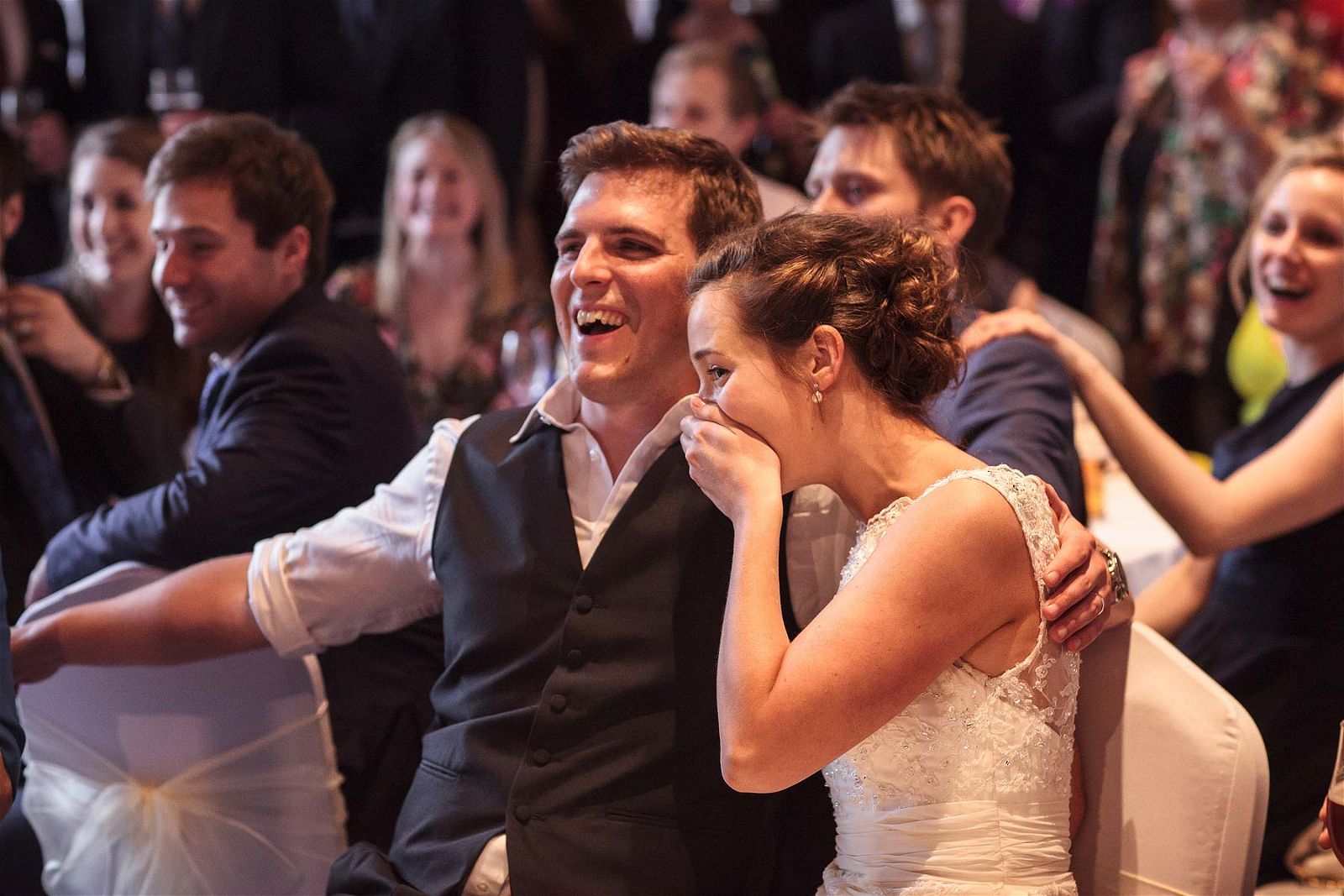 Candid photographs that show the fun of the evening reception in the Tithe Barn at Hundred House Hotel in Norton by Shropshire Documentary Wedding Photographer Stuart James