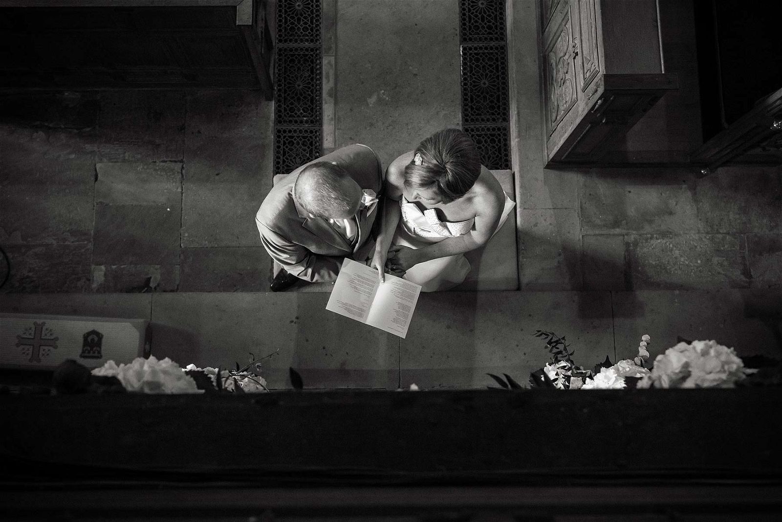 Reportage photographs of vows and ring exchange at All Saints Church in Sandon by Staffordshire Wedding Photographer Stuart James