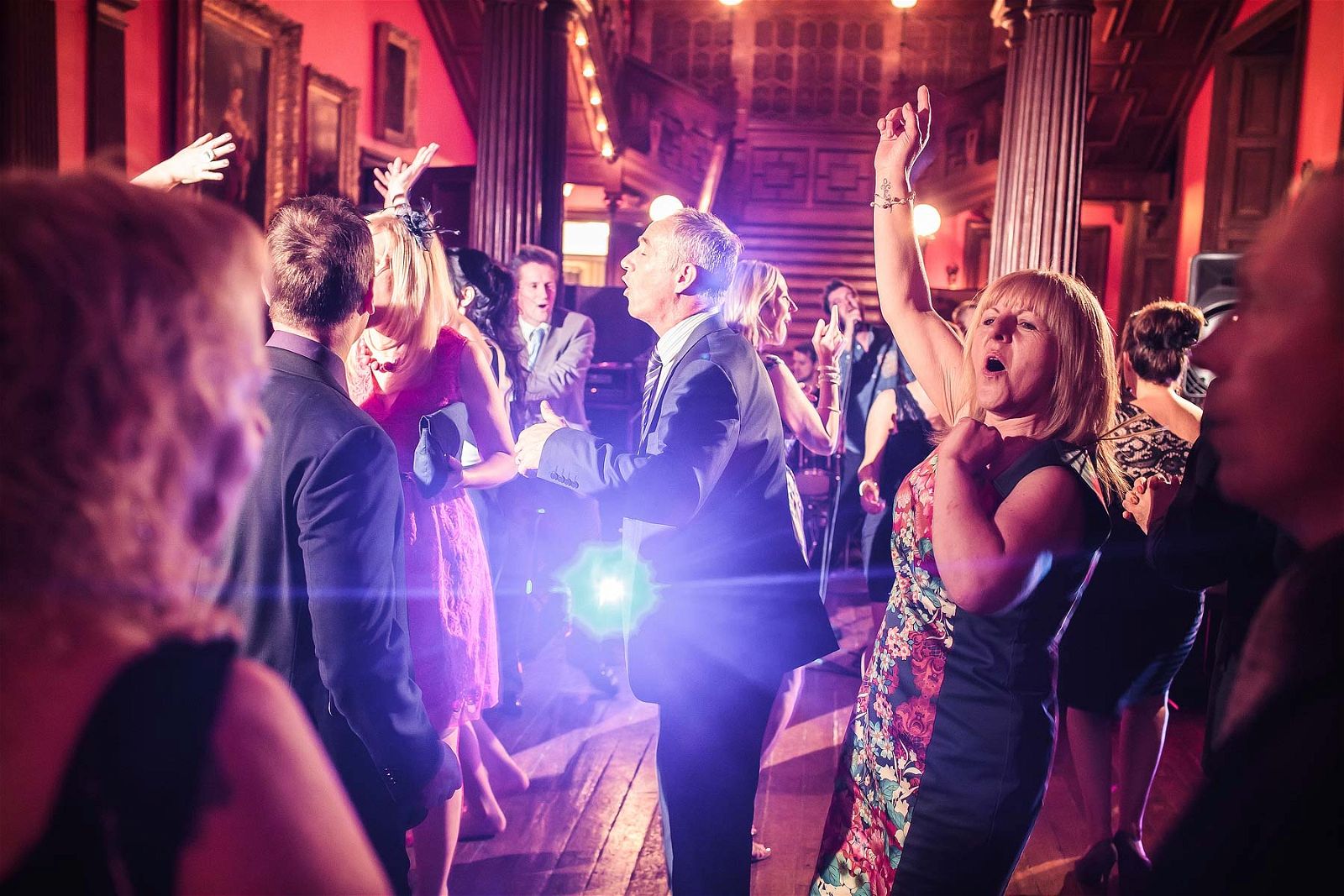 Candid photographs of the fantastic party at Sandon Hall in Staffordshire by Documentary Wedding Photographer Stuart James