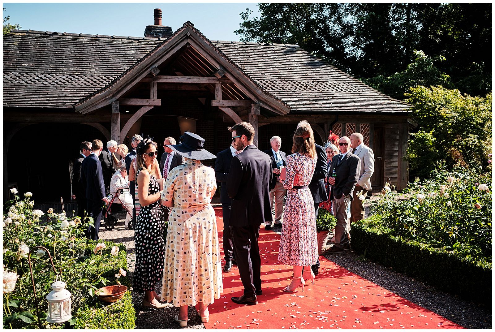 Candid photographs capturing the guests greeting the newlyweds at Goldstone Hall in Shropshire by Documentary Wedding Photographer Stuart James
