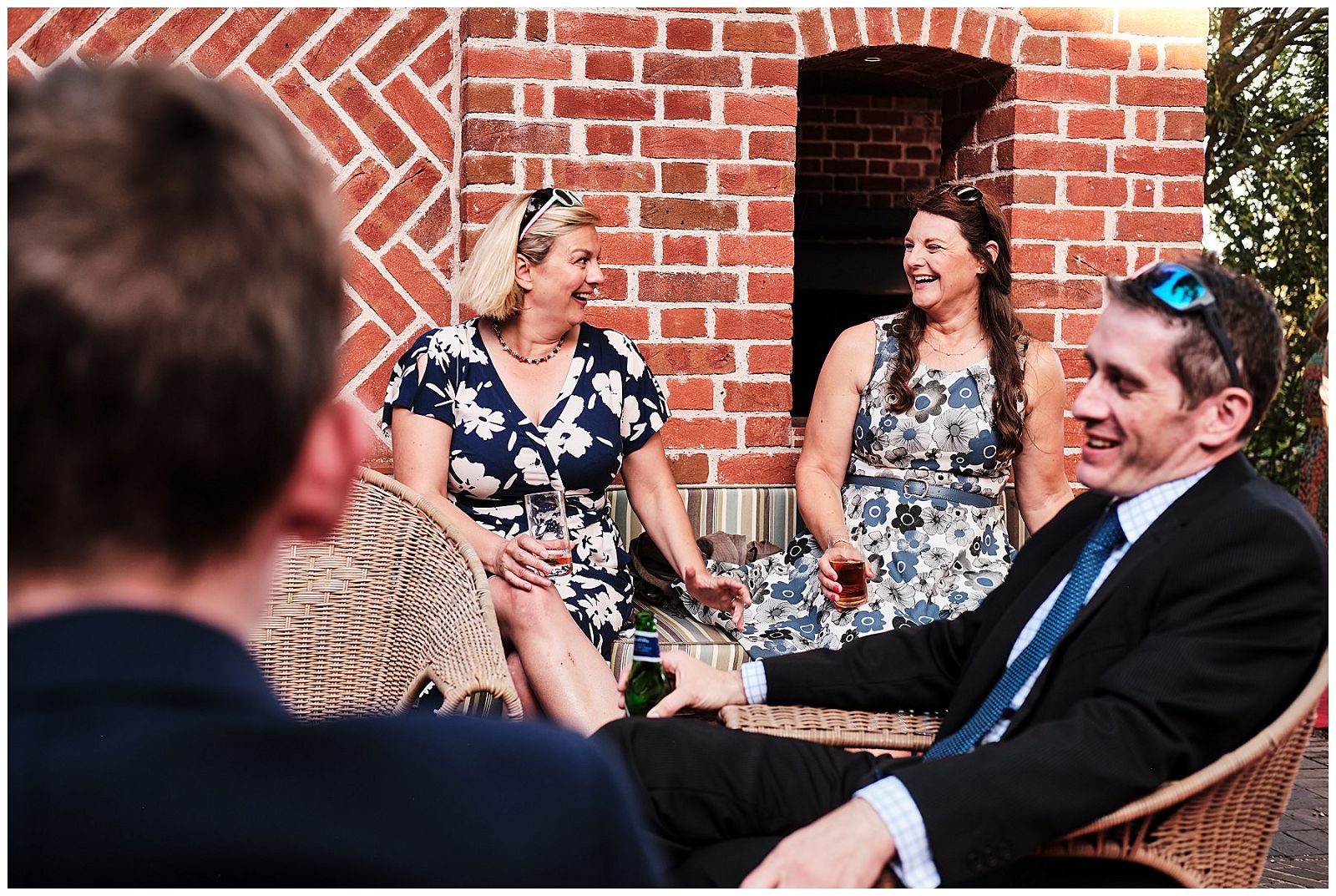 Reportage photographs capturing guests greeting each other for the wedding reception at Goldstone Hall in Shropshire by Documentary Wedding Photographer Stuart James