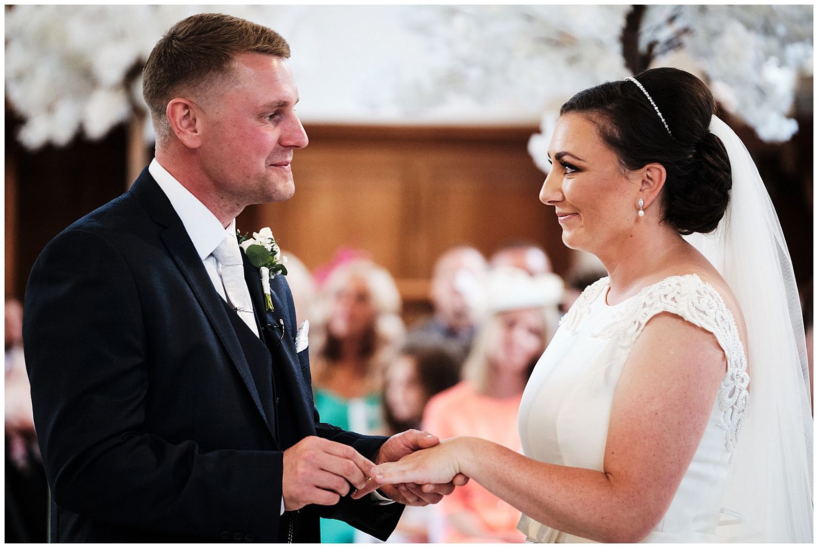 Capturing the exchange of rings at Hawkstone Hall in Shrewsbury by Documentary Wedding Photographer Stuart James