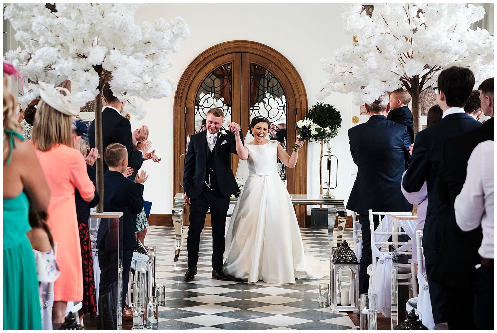 Exiting in style with the best reactions at Hawkstone Hall in Shrewsbury by Documentary Wedding Photographer Stuart James
