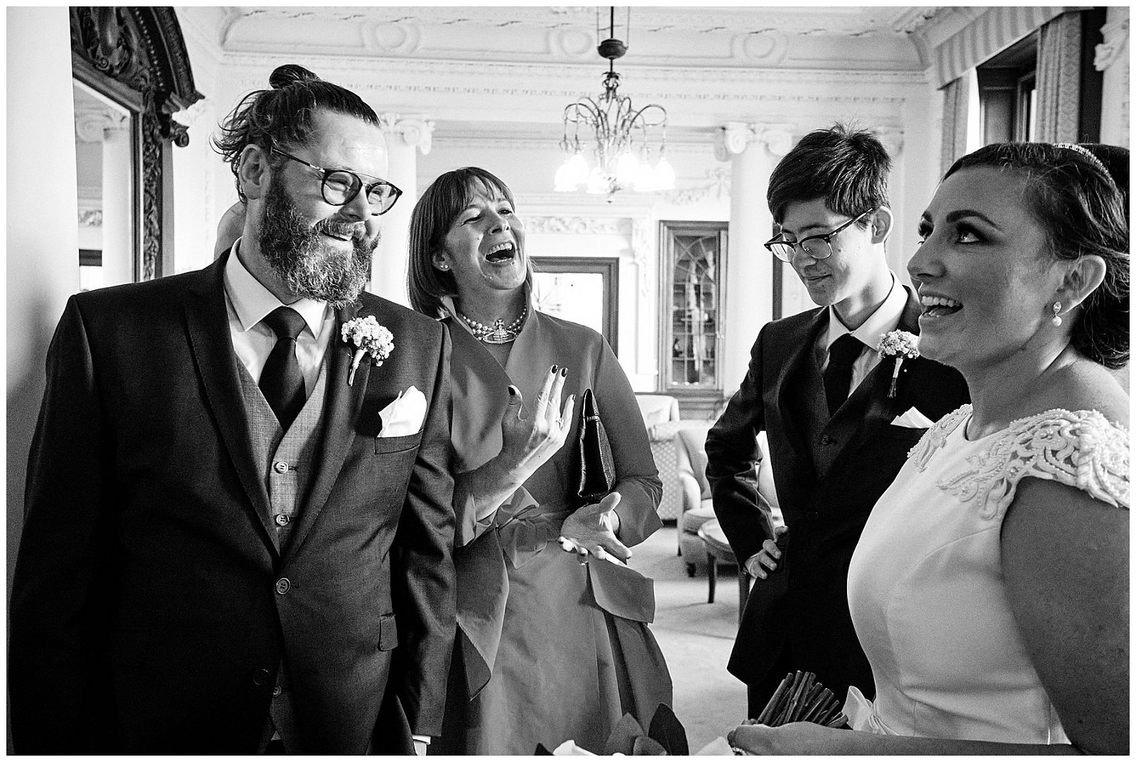 Creative candid photographs of the guests greeting the newlyweds and offering their congratulations at Hawkstone Hall in Shrewsbury by Documentary Wedding Photographer Stuart James