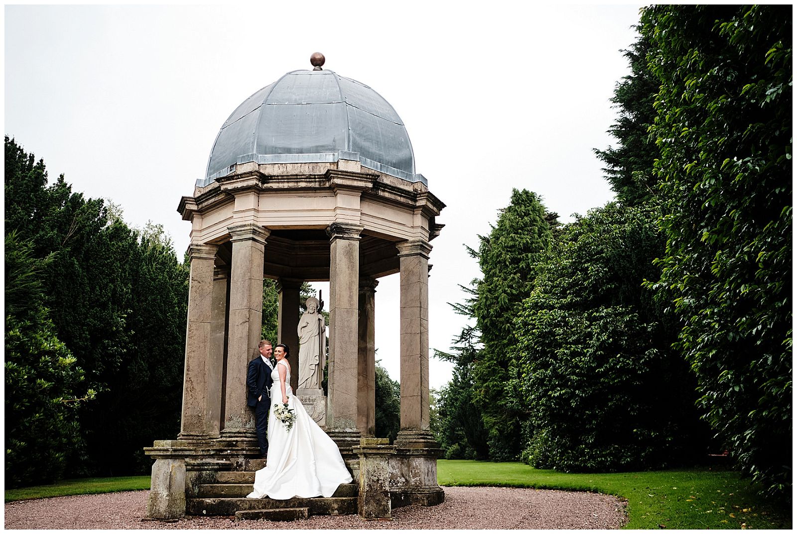 Using the character of the grounds to add beautiful scenes for the couples portraits at Hawkstone Hall in Shrewsbury by Documentary Wedding Photographer Stuart James