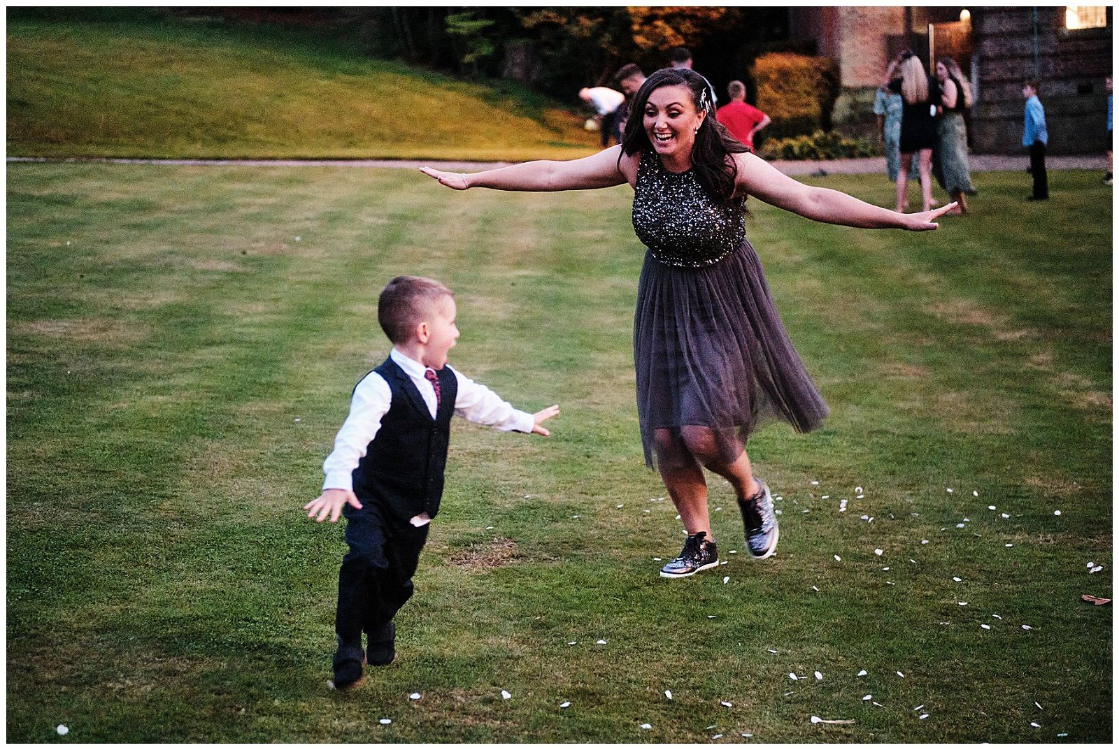 Brilliant fun as the guests enjoying the mild summer evening on the lawns at Hawkstone Hall in Shrewsbury by Documentary Wedding Photographer Stuart James