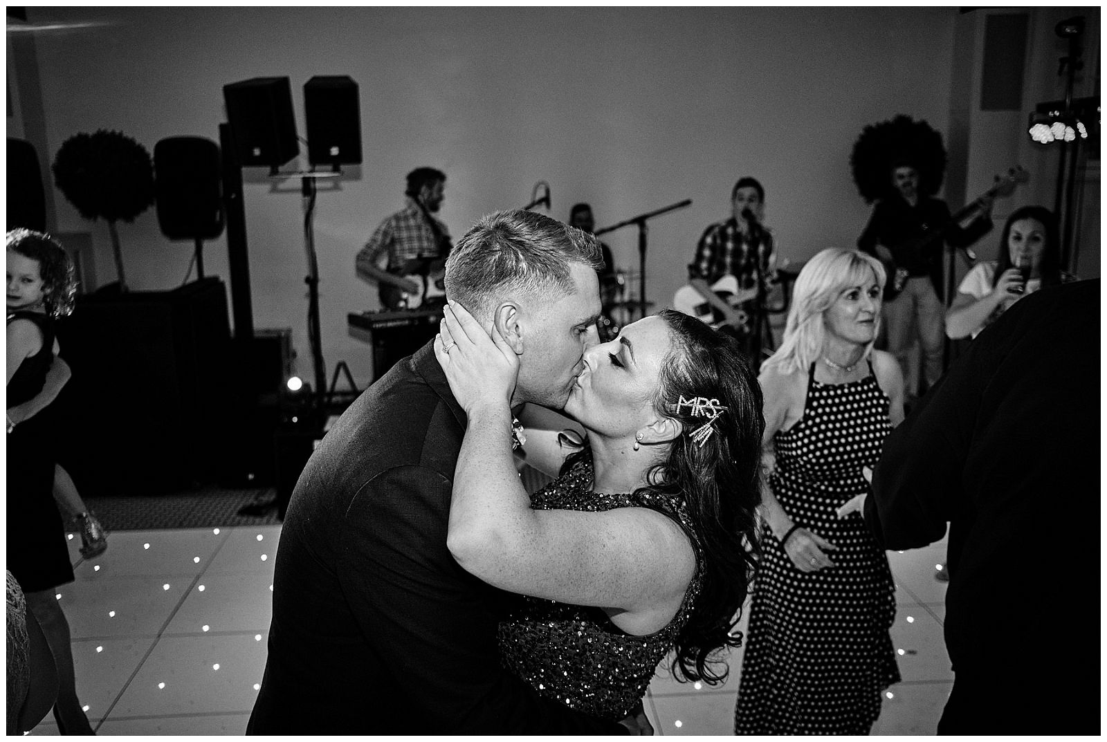 Early evening fun on the dance floor with the House of Chords wedding band providing great entertainment at Hawkstone Hall in Shrewsbury by Documentary Wedding Photographer Stuart James